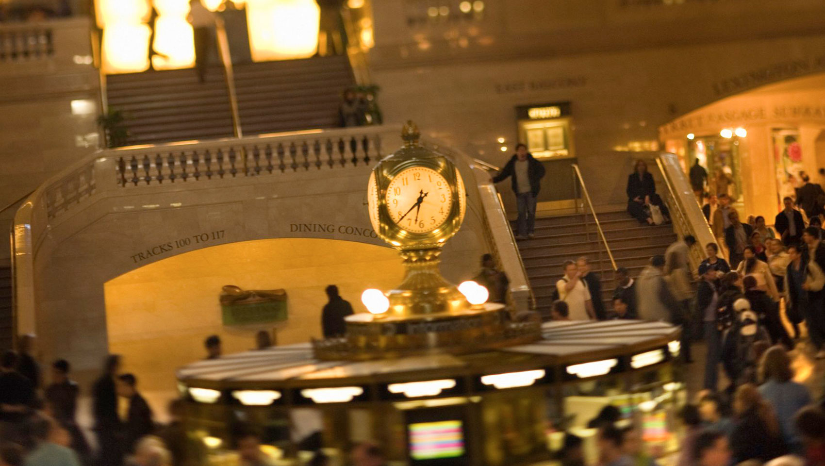 People passing through a busy grand central station